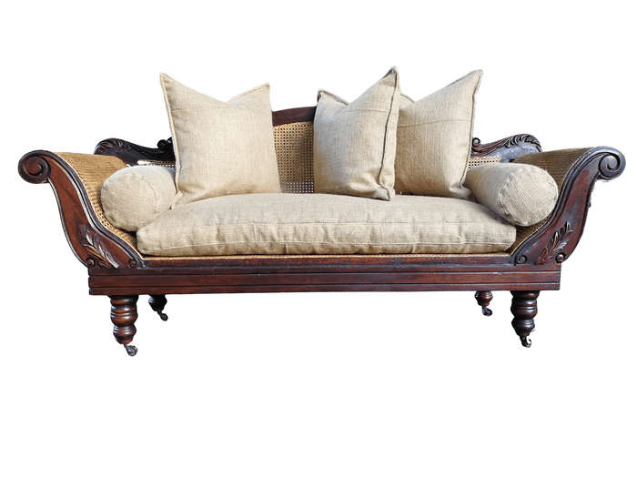 An Antique Victorian Carved Mahogany and Rattan Settee On Castors with Hessian Cushions and Bolsters