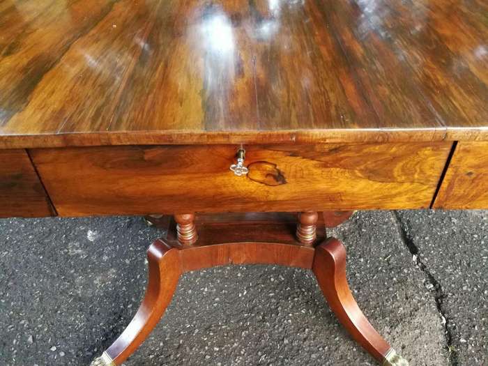 A Circa 1800 Regency Rosewood pembroke table, on castors