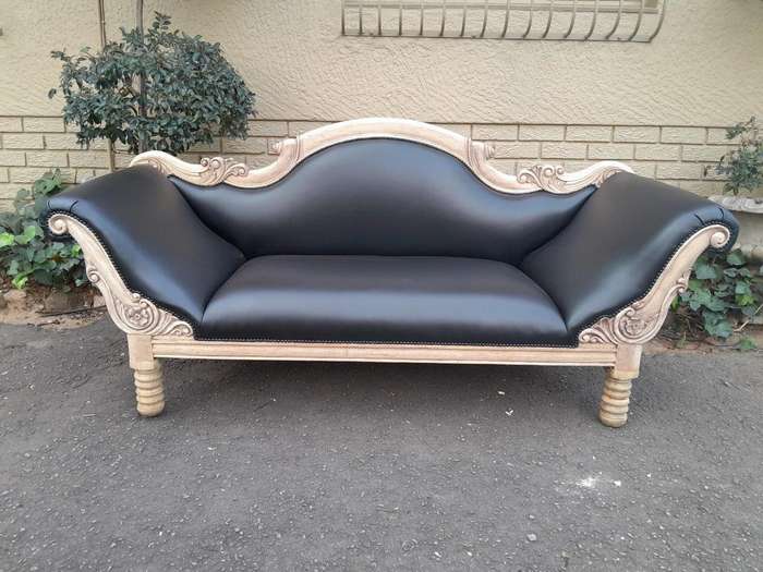 A 20th Century  Carved Mahogany Wooden Settee With Brass Castors, Upholstered In Leather In A Ble...