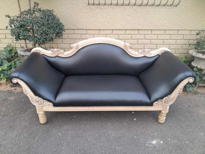 A 20th Century  Carved Mahogany Wooden Settee With Brass Castors, Upholstered In Leather In A Ble...