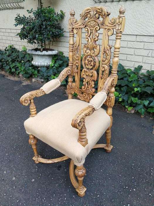 A Flemish Style Carved Wooden Armchair