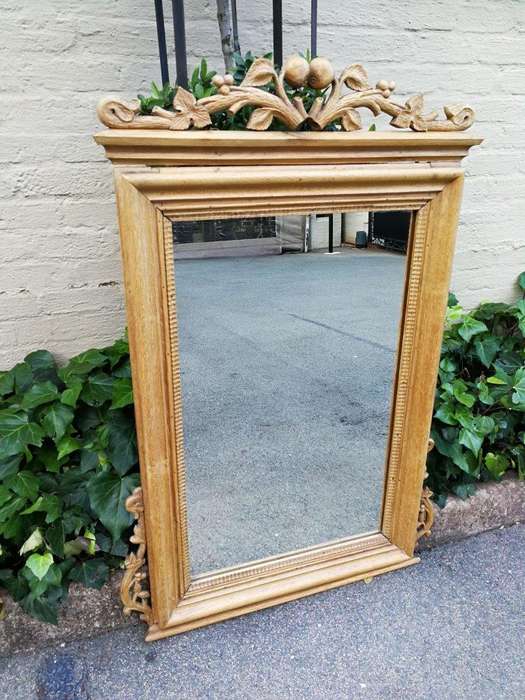 An Early 1900s (Possibly Victorian) Ornately Carved Natural Wooden Mirror