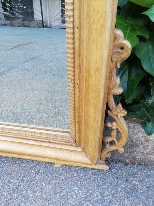 An Early 1900s (Possibly Victorian) Ornately Carved Natural Wooden Mirror