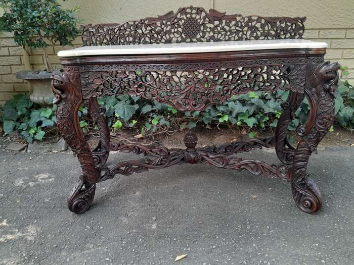 A 19th Century Anglo-Indian Carved Rosewood Serpentine Console Table With Marble Top