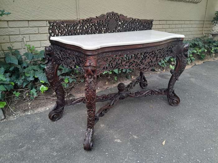 A 19th Century Anglo-Indian Carved Rosewood Serpentine Console Table With Marble Top