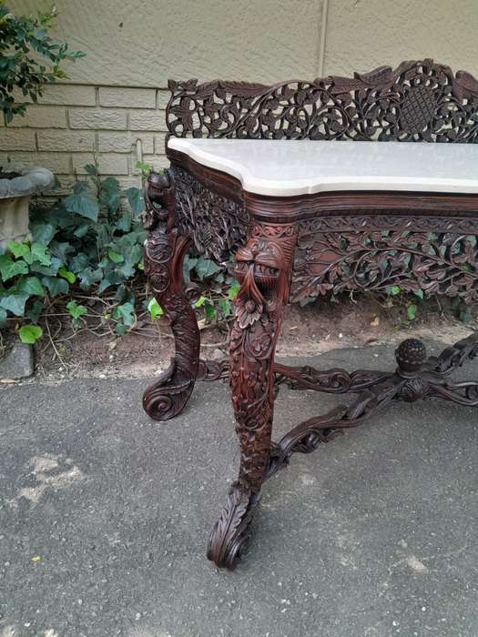 A 19th Century Anglo-Indian Carved Rosewood Serpentine Console Table With Marble Top