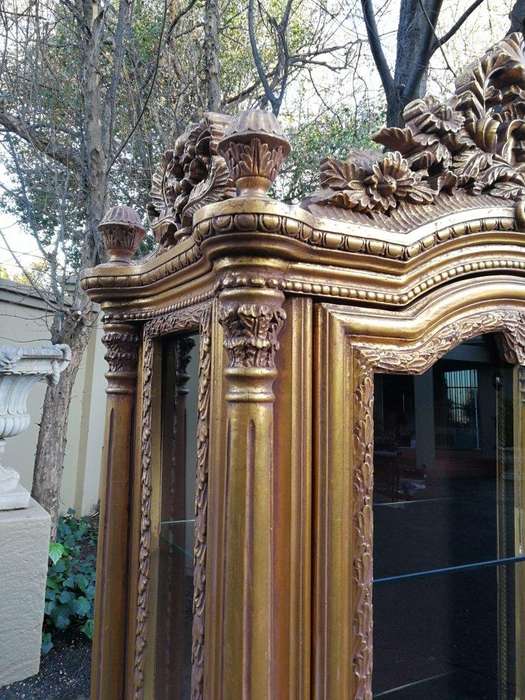 A Rare Pair of 20th Century Giltwood Display Cabinets