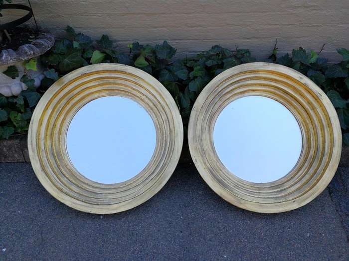 A Pair Of Circular Bevelled Wooden Mirrors with a Hand-gilded Gold Leaf Detail