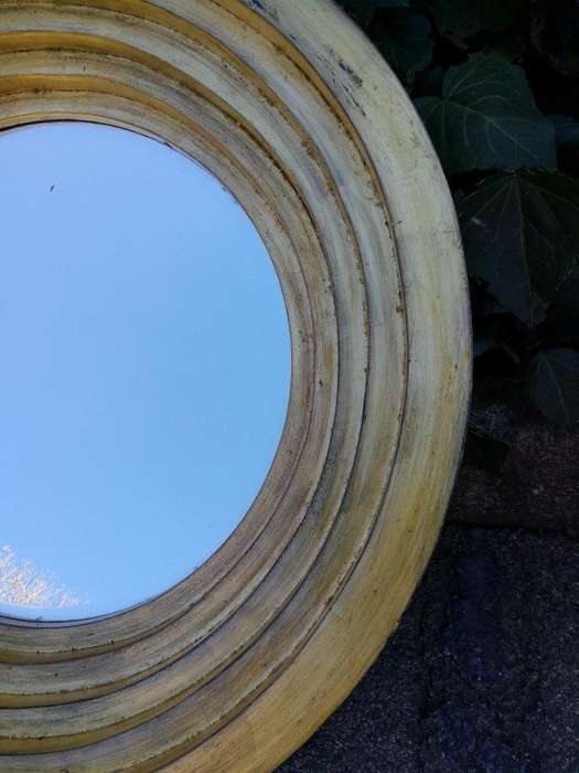 A Pair Of Circular Bevelled Wooden Mirrors with a Hand-gilded Gold Leaf Detail