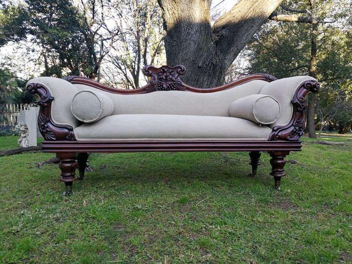 A Victorian Mahogany Settee In A Contemporary Wood Finish With Castors