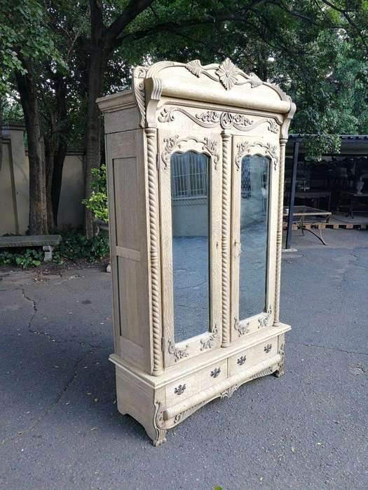 An Antique Victorian English Carved And Bleached Oak Armoire With Bevelled Mirror Doors And Two D...