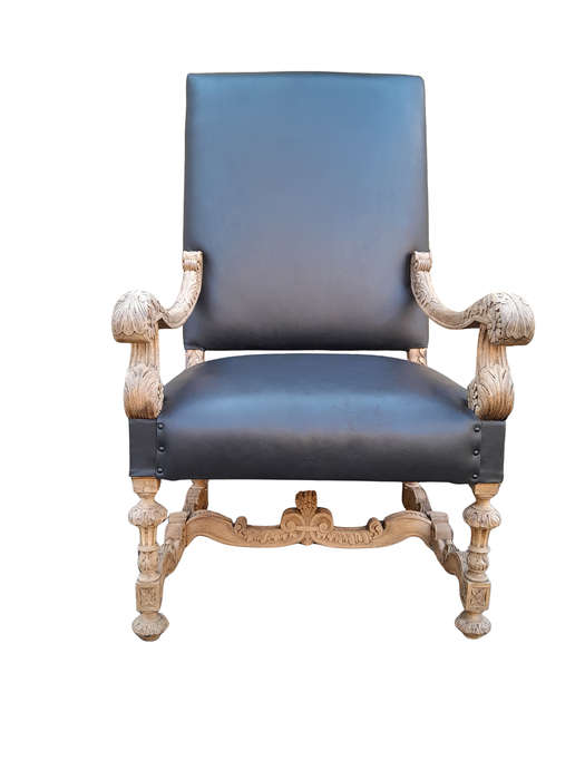 An Antique Ornately Carved Oak Throne Armchair Upholstered in Leather and in a Contemporary Bleac...
