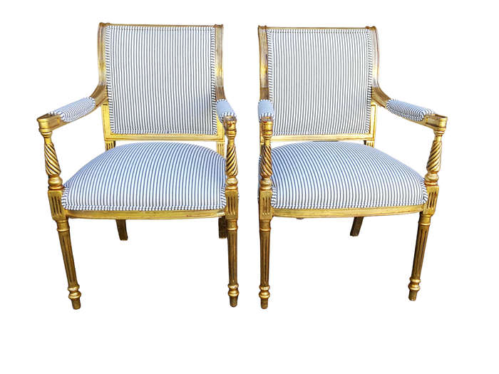 A Pair Of Carved And Gilded Armchairs