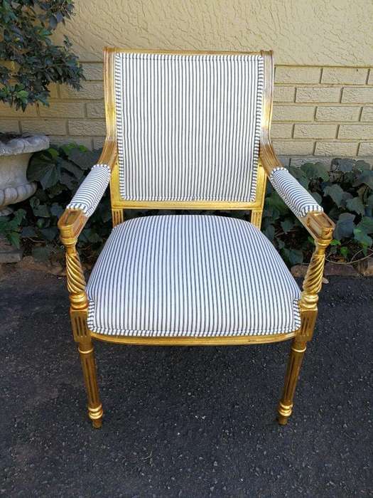 A Pair Of Carved And Gilded Armchairs