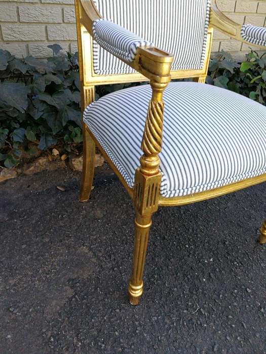 A Pair Of Carved And Gilded Armchairs
