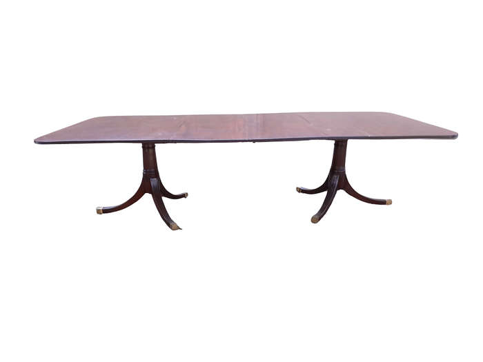 A 20th Century Mahogany Dining Table with Two Extensions and Brass Feet & Casters