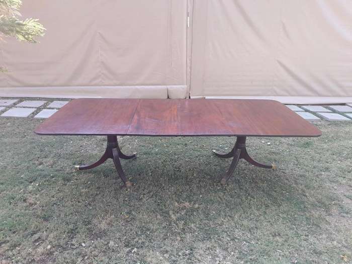 A 20th Century Mahogany Dining Table with Two Extensions and Brass Feet & Casters