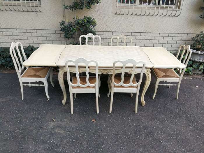 A 20TH Century French Set of Six Carved Dining Chairs with Rush Seats in a Contemporary Bleached ...