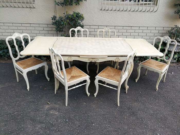 A 20TH Century French Set of Six Carved Dining Chairs with Rush Seats in a Contemporary Bleached ...