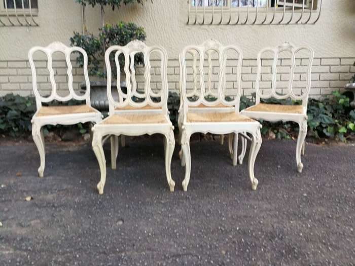 A 20TH Century French Set of Six Carved Dining Chairs with Rush Seats in a Contemporary Bleached ...
