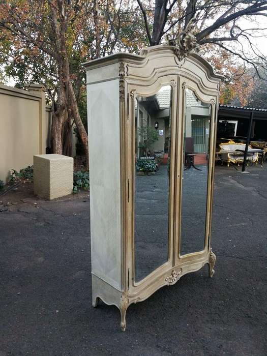 A 19th Century French Rococo Armoire In A Bleached Contemporary Finish With Bevelled Mirrors