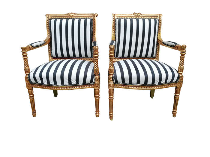A Pair Of Louis XVI Style Carved And Gilded Armchairs