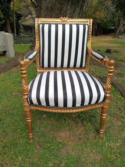 A Pair Of Louis XVI Style Carved And Gilded Armchairs