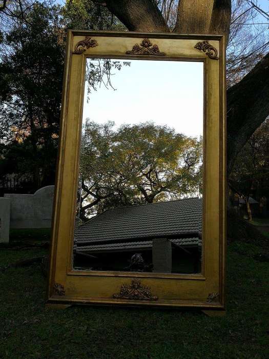 A French Style Ornately Carved and Gilded Bevelled Mirror