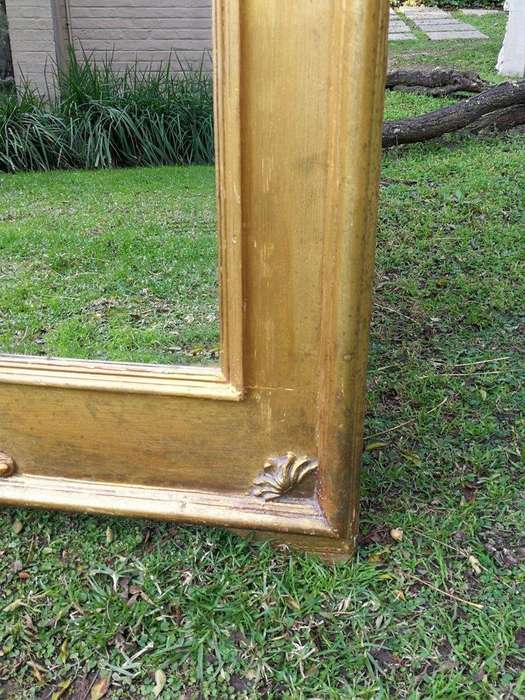 A French Style Ornately Carved and Gilded Bevelled Mirror