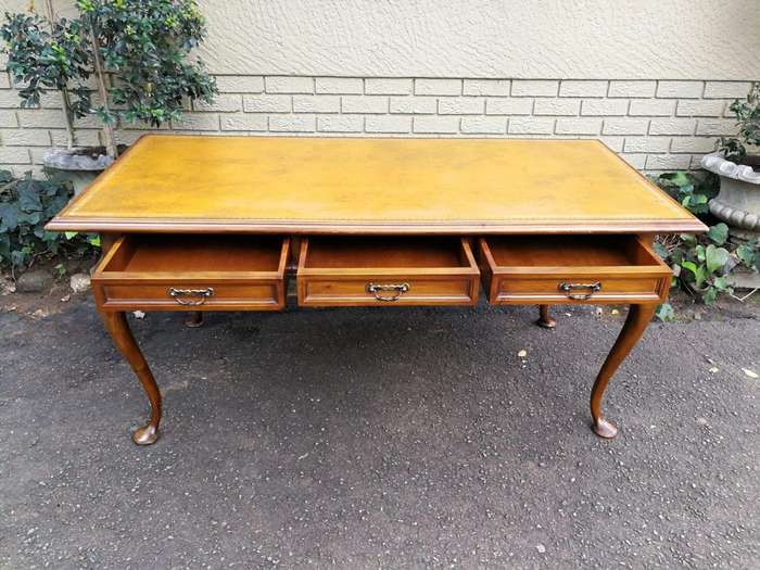 A 20th Century Victorian-Style Blonde Mahogany Desk With Leather And Gilt Tooling And Three Drawe...
