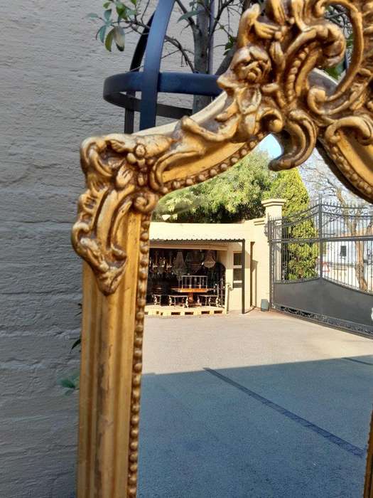 An Ornate Rococo French Style Carved Bevelled Mirror