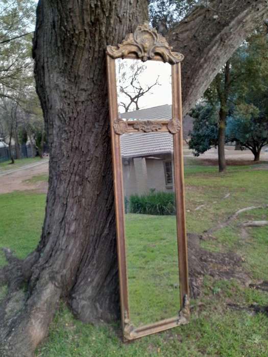 An Ornate Carved Rococo French Style Bevelled Mirror