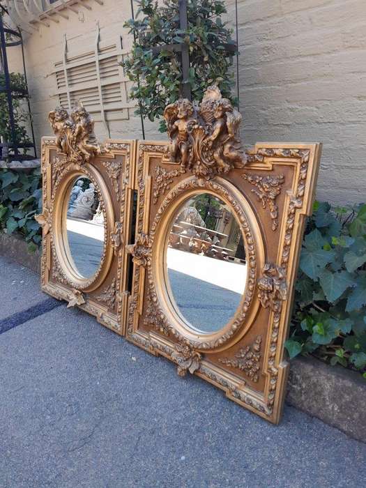 An Exceptional Pair of 20th Century French Style Ornately Carved and Gilded Bevelled Mirrors with...