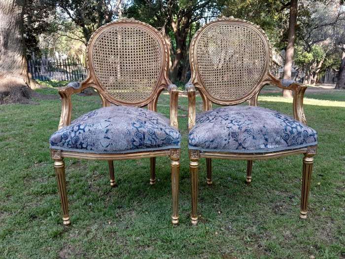 A Pair of 20th Century French Style Rattan-Back Gilded Arm Chairs