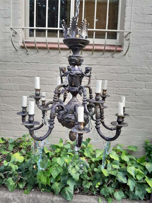 A 20th Century French Style Brass and Crystal Chandelier with Brass and Crystals