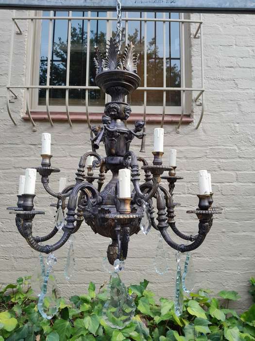 A 20th Century French Style Brass and Crystal Chandelier with Brass and Crystals