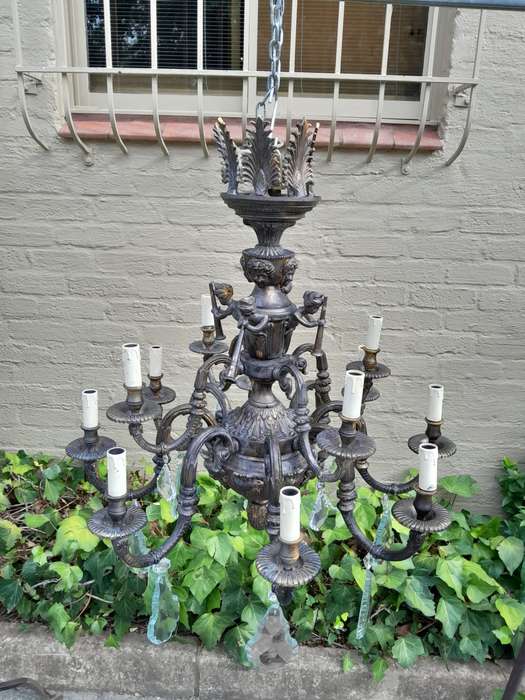 A 20th Century French Style Brass and Crystal Chandelier with Brass and Crystals