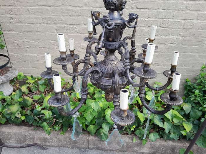 A 20th Century French Style Brass and Crystal Chandelier with Brass and Crystals