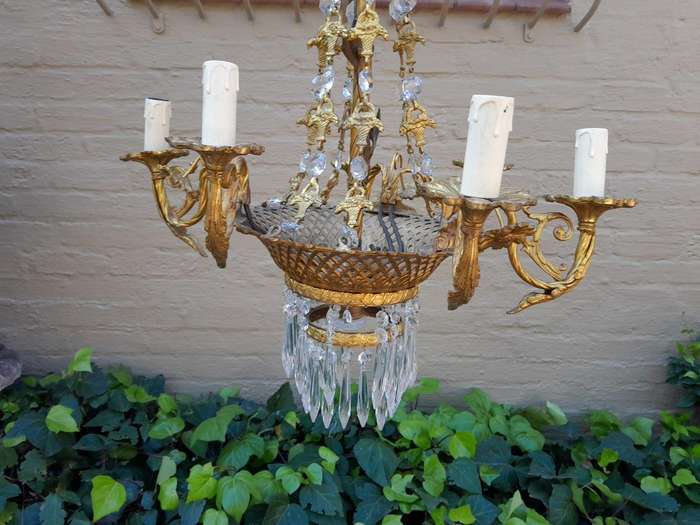 A 20th Century French Style Brass & Aged Crystal Chandelier
