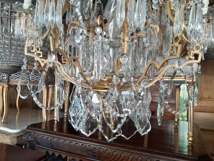 A 20th Century Large French Style Brass And Crystal Chandelier