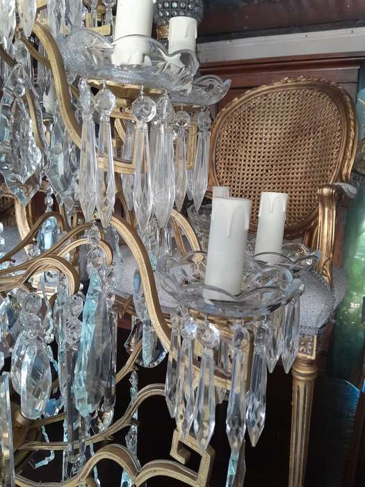 A 20th Century Large French Style Brass And Crystal Chandelier