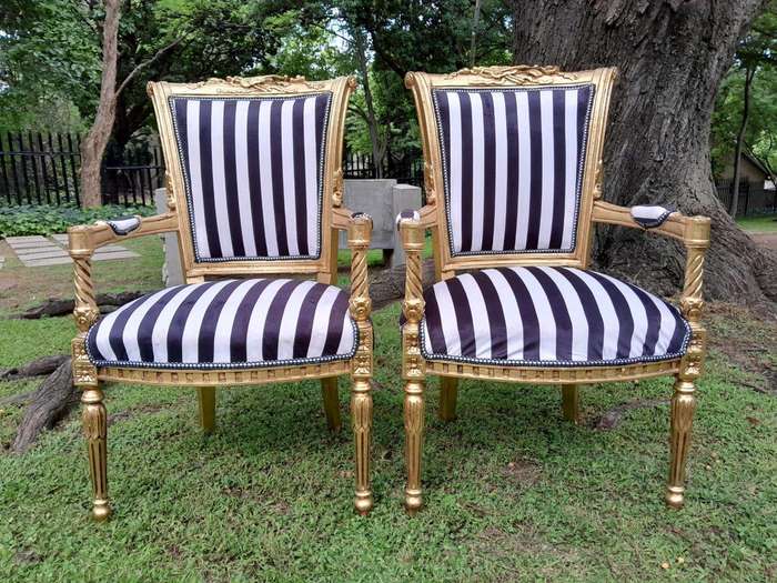 A Pair Of 20th Century French Louis XVI Styled Ornately Carved And Gilded Fautelli Chairs (variou...