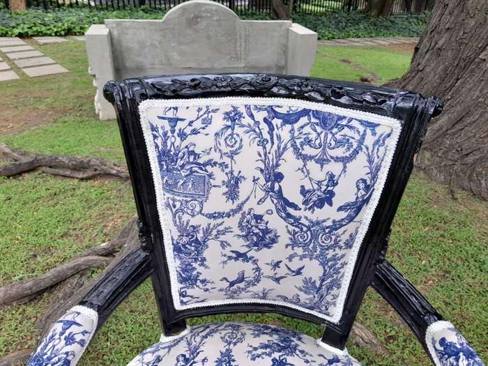 A Pair Of 20th Century French Louis XVI Styled Ornately Carved And Gilded Arm Chairs