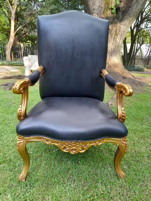 A 20TH Century Pair Of French Style Carved and Giltwood High Back Armchairs Upholstered in Leather
