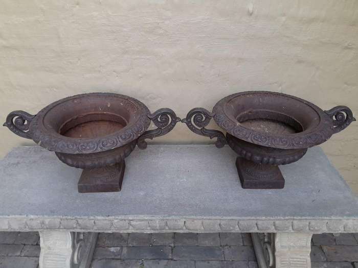 A 20th Century Pair Of Decorative Cast Iron Urns