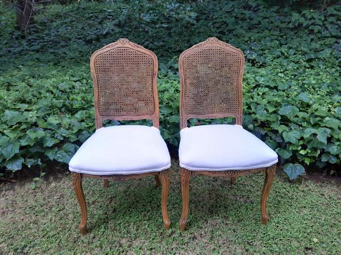 A Rare 20th Century Set Of Twelve French Colonial Style Walnut Rattan Dining Chairs