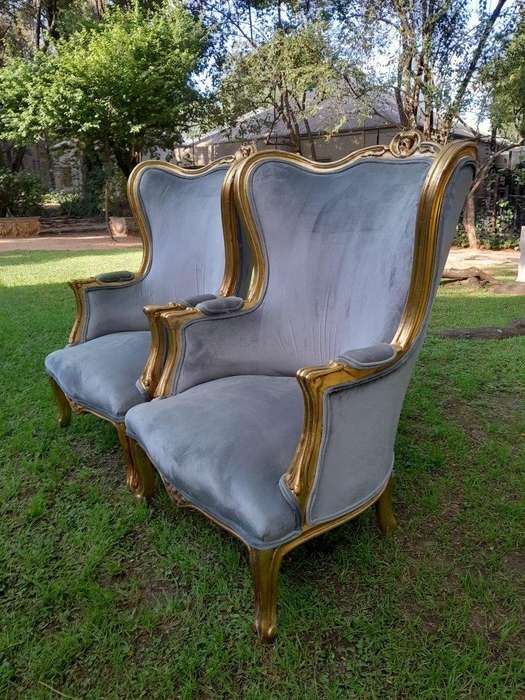 A Pair Of French Style Carved Wooden Wingback Armchairs