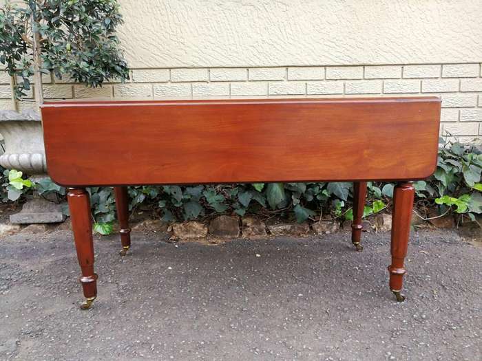 An Early 20th Century Mahogany Pembroke Table On Turned Legs