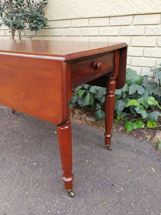 An Early 20th Century Mahogany Pembroke Table On Turned Legs