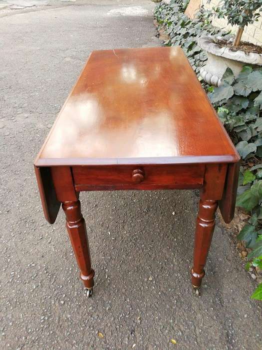 An Early 20th Century Mahogany Pembroke Table On Turned Legs